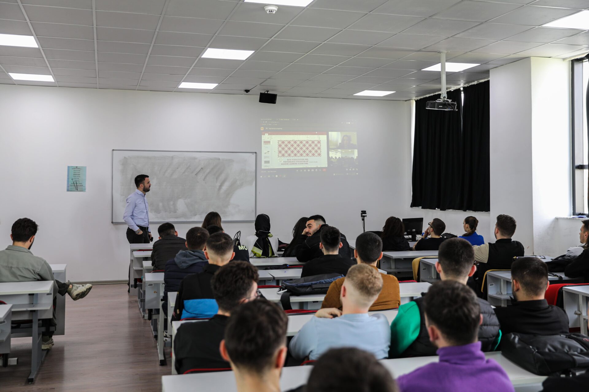 The professor from "Logos" University College holds a lecture for the students of AAB College