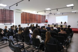 The representative from the Oriflame company informs the students about "Business Opportunity" and "Digital Entrepreneurship"
