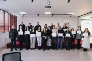 Certificates are distributed to participants in Microsoft Office training at AAB College